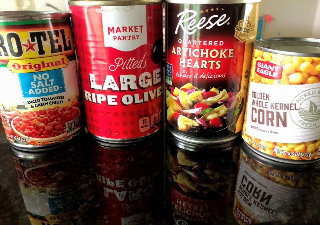 4 cans: diced tomatoes with green chiles, olives, artichoke hearts, and corn